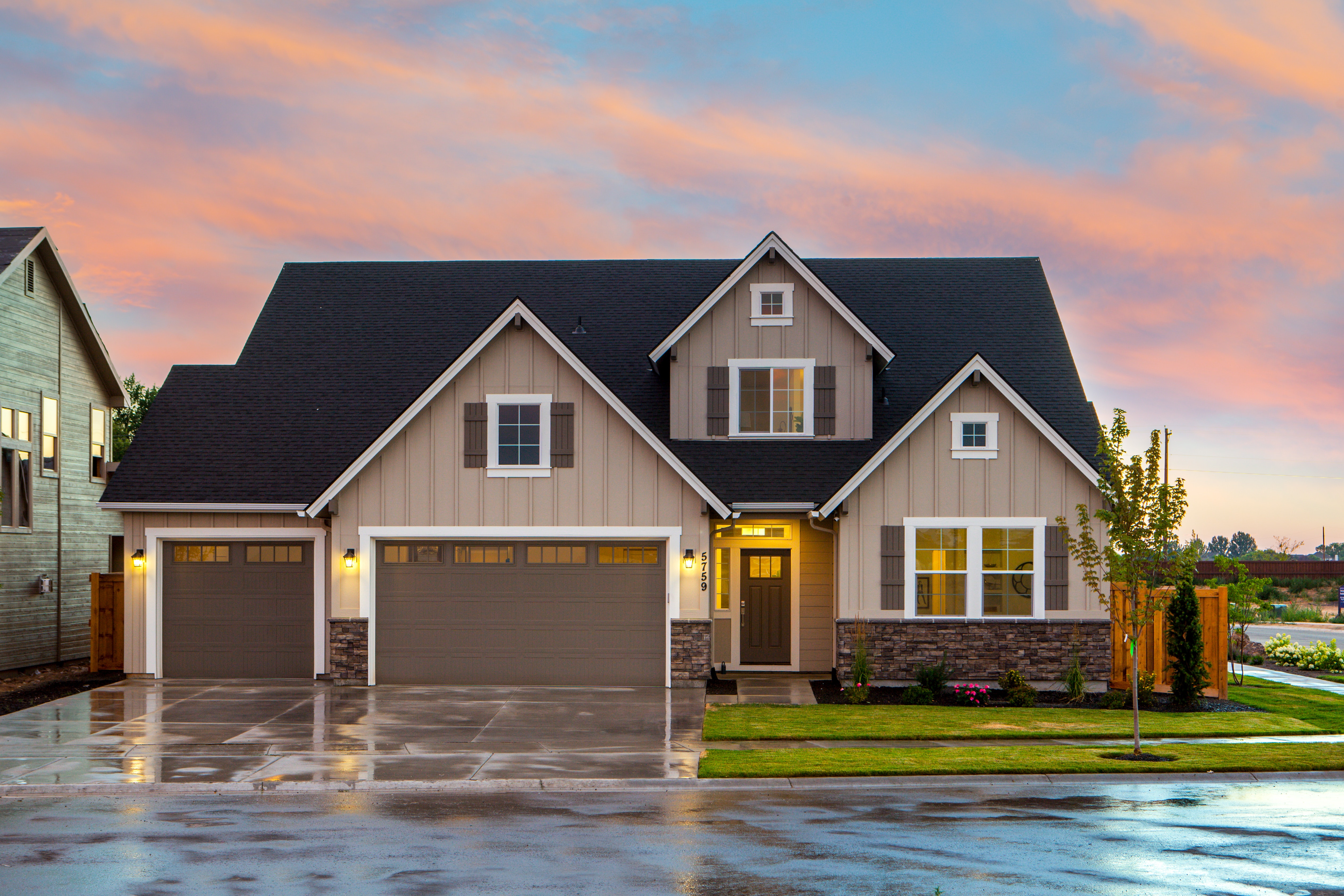 brown-and-gray-painted-house-in-front-of-road-1396122